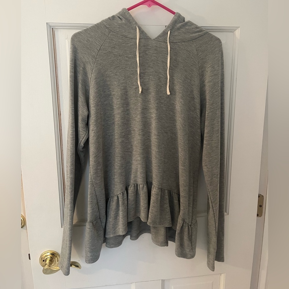 Adorable grey peplum long sleeved hoodie.